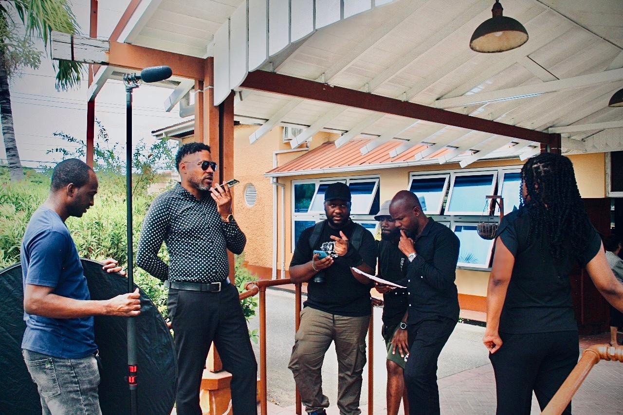 Cast and crew preparing a scene on the set of Tangled Webs